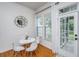 Cozy breakfast nook with a round white table, chairs, and natural light at 3012 Candela Grove Dr, Charleston, SC 29414