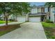 Inviting townhomes featuring attached garages and well-maintained driveways, blending convenience with classic appeal at 3012 Candela Grove Dr, Charleston, SC 29414