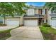 Charming townhomes with attached garages and well-maintained driveways, offering both convenience and curb appeal at 3012 Candela Grove Dr, Charleston, SC 29414