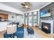 Cozy living room featuring a fireplace, hardwood floors, and an open layout, perfect for modern living and relaxation at 3012 Candela Grove Dr, Charleston, SC 29414