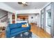Bright living area with an open layout, hardwood floors, and inviting decor, seamlessly connecting to the kitchen at 3012 Candela Grove Dr, Charleston, SC 29414
