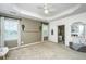 Large main bedroom featuring neutral wall, tray ceiling, and ensuite bath access at 3012 Candela Grove Dr, Charleston, SC 29414