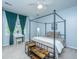 Main bedroom with four poster bed, vanity and green curtains provides a relaxing retreat at 3012 Candela Grove Dr, Charleston, SC 29414