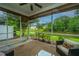 Relaxing screened porch with view of pond and landscaping at 3012 Candela Grove Dr, Charleston, SC 29414