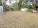 Large backyard featuring a storage shed, trees, and a partial fence at 3034 Maybank Hwy, Johns Island, SC 29455