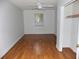 Bedroom featuring laminate floors, natural light from one window and a ceiling fan at 3034 Maybank Hwy, Johns Island, SC 29455