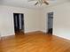 Bright, airy bedroom with hardwood flooring, ceiling fan, and closet at 3034 Maybank Hwy, Johns Island, SC 29455