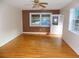 Bright living area with hardwood floors, fresh paint, a ceiling fan, and natural light at 3034 Maybank Hwy, Johns Island, SC 29455