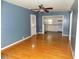 Inviting living space with hardwood flooring, a ceiling fan, and seamless connection to the kitchen at 3034 Maybank Hwy, Johns Island, SC 29455