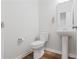 Clean half bath featuring a pedestal sink and neutral wall color at 304 Torslanda Ln, Summerville, SC 29486