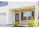 Charming townhome with stone accents, complemented by a one-car garage and manicured landscaping at 304 Torslanda Ln, Summerville, SC 29486