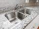 Close up of stainless steel double sink and granite counter at 304 Torslanda Ln, Summerville, SC 29486