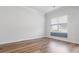 Bright room featuring neutral walls, elegant trim and hardwood flooring at 304 Torslanda Ln, Summerville, SC 29486