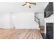 Bright living room with fireplace, TV, and staircase at 304 Torslanda Ln, Summerville, SC 29486