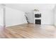 Spacious living room with wood-look floors, fireplace, and staircase at 304 Torslanda Ln, Summerville, SC 29486