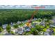 Aerial view pinpoints the property in its wooded, well-established neighborhood at 311 Aberdeen Cir, Summerville, SC 29483