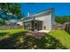 Spacious backyard featuring a screened porch and lush landscaping at 311 Aberdeen Cir, Summerville, SC 29483