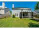Large backyard with screened-in porch, providing a perfect outdoor living space at 311 Aberdeen Cir, Summerville, SC 29483