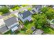 Aerial view of the backyard featuring a screened patio, shed, and well-maintained lawn and garden at 311 Aberdeen Cir, Summerville, SC 29483