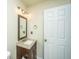 Bathroom with wood vanity, granite counter, and a framed mirror at 311 Aberdeen Cir, Summerville, SC 29483