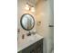 Bathroom vanity featuring a white countertop, modern faucet, and bronze hardware at 311 Aberdeen Cir, Summerville, SC 29483