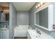 Well-lit bathroom features double sinks, bathtub and shower combination, and updated fixtures at 311 Aberdeen Cir, Summerville, SC 29483
