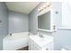 Bathroom featuring a tub, sleek vanity and framed mirror, offering a clean and modern aesthetic at 311 Aberdeen Cir, Summerville, SC 29483