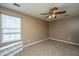 Neutral bedroom features a ceiling fan, window with blinds and carpeted floors at 311 Aberdeen Cir, Summerville, SC 29483