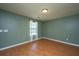 Bedroom with wood-look flooring, light green walls, a large window, and bright natural light at 311 Aberdeen Cir, Summerville, SC 29483