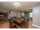 Cozy dining room featuring a rustic table, wood floors, and open floor plan at 311 Aberdeen Cir, Summerville, SC 29483