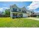 Charming two-story home with a manicured lawn and inviting curb appeal at 311 Aberdeen Cir, Summerville, SC 29483