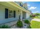 A detailed view of the home's exterior shows manicured shrubs and a well-maintained lawn at 311 Aberdeen Cir, Summerville, SC 29483