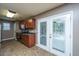 Bright kitchen featuring modern appliances and leads to the back patio through double doors at 311 Aberdeen Cir, Summerville, SC 29483