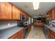 Kitchen view opens to living room with fireplace and open concept floorplan at 311 Aberdeen Cir, Summerville, SC 29483