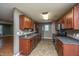 The kitchen features dark wood cabinets, stainless-steel appliances, and ample counter space at 311 Aberdeen Cir, Summerville, SC 29483
