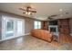 The bright living room boasts built-in shelves, a fireplace, and French doors leading outside at 311 Aberdeen Cir, Summerville, SC 29483