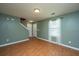 Spacious living room with wood-look flooring, light green walls, and plenty of natural light at 311 Aberdeen Cir, Summerville, SC 29483