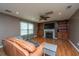 Spacious living room with built-in shelving, fireplace, and ceiling fan at 311 Aberdeen Cir, Summerville, SC 29483
