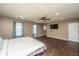 Spacious main bedroom with ceiling fan, recessed lighting, and two windows with custom drapes at 311 Aberdeen Cir, Summerville, SC 29483