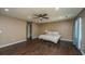 Spacious main bedroom features modern ceiling fan and laminate flooring, with room to relax at 311 Aberdeen Cir, Summerville, SC 29483