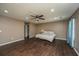 Spacious main bedroom with ceiling fan, recessed lighting, and two windows with custom drapes at 311 Aberdeen Cir, Summerville, SC 29483