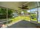 Screened patio with ceiling fan and a view of the shed and backyard at 311 Aberdeen Cir, Summerville, SC 29483