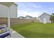 Well-maintained backyard with lush green lawn, privacy fence, and a cozy seating area at 330 Ripple Park Dr, Summerville, SC 29486