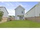 A beautiful backyard featuring lush green grass, a wooden fence, and a cozy patio at 330 Ripple Park Dr, Summerville, SC 29486