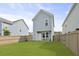 Backyard featuring manicured lawn, charming fencing, and quaint patio with chairs at 330 Ripple Park Dr, Summerville, SC 29486