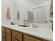 Bathroom with a double sink vanity and a framed mirror reflecting the shower and bath fixtures at 330 Ripple Park Dr, Summerville, SC 29486