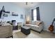 Well-lit bedroom complete with a desk and sofa area, a perfect space for relaxation and productivity at 330 Ripple Park Dr, Summerville, SC 29486