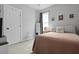 Cozy bedroom features a full size bed, a large window, modern décor and soft carpeting at 330 Ripple Park Dr, Summerville, SC 29486