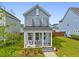 Charming two-story home featuring a cozy front porch and well-manicured landscaping at 330 Ripple Park Dr, Summerville, SC 29486