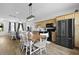 Open concept eat-in kitchen with wood cabinets, a rustic wooden dining table, stainless appliances, and a view of the living room at 330 Ripple Park Dr, Summerville, SC 29486